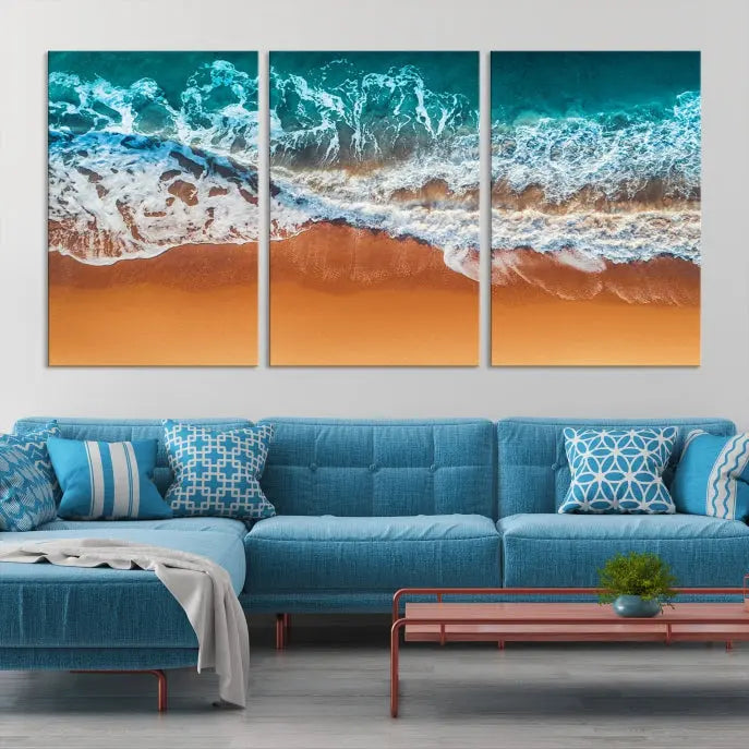 The "Ocean Beach Wall Art Nautical Landscape Canvas Print" is a stunning triptych of aerial ocean waves on museum-quality canvas with UV-protective coating. It's ready to hang and can instantly transform your space.