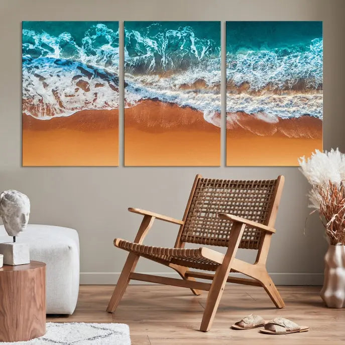 The "Ocean Beach Wall Art Nautical Landscape Canvas Print" is a stunning triptych of aerial ocean waves on museum-quality canvas with UV-protective coating. It's ready to hang and can instantly transform your space.