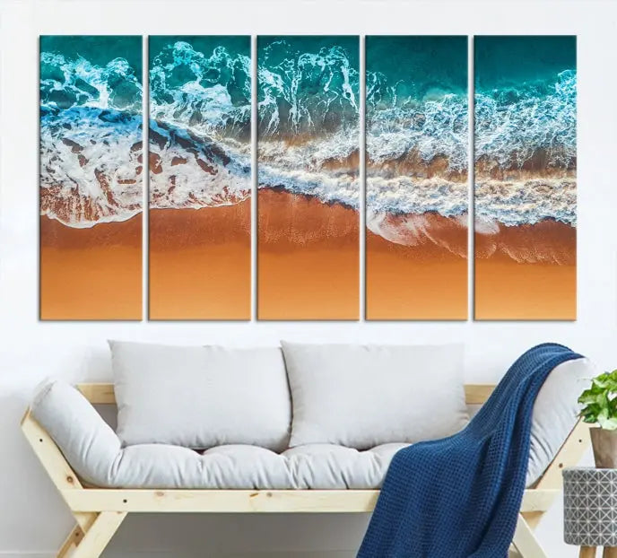 The "Ocean Beach Wall Art Nautical Landscape Canvas Print" is a stunning triptych of aerial ocean waves on museum-quality canvas with UV-protective coating. It's ready to hang and can instantly transform your space.