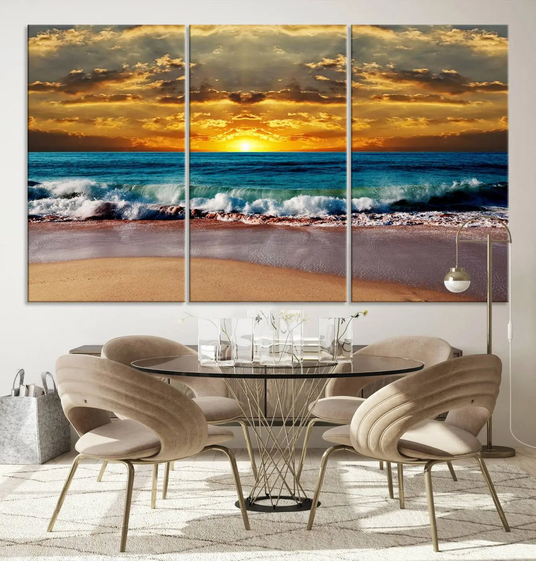 A large piece of coastal wall art titled "Ocean Sunrise Over Golden Beach Waves," featuring a stunning sunset over the ocean on high-quality stretched canvas, is ready to hang.