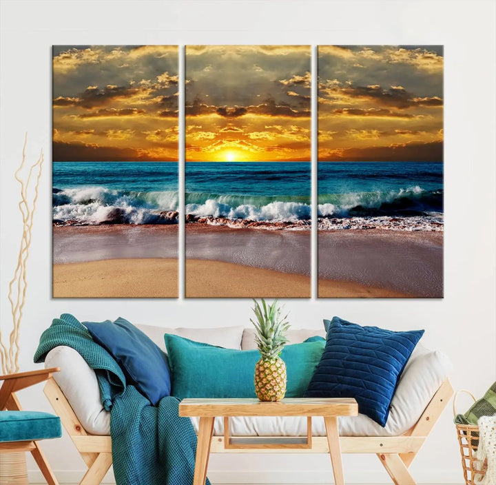 The Ocean Sunrise Over Golden Beach Waves giclee canvas wall art set hangs above, capturing a serene coastal sunset. This high-quality stretched canvas print brings warmth and tranquility to any living space.