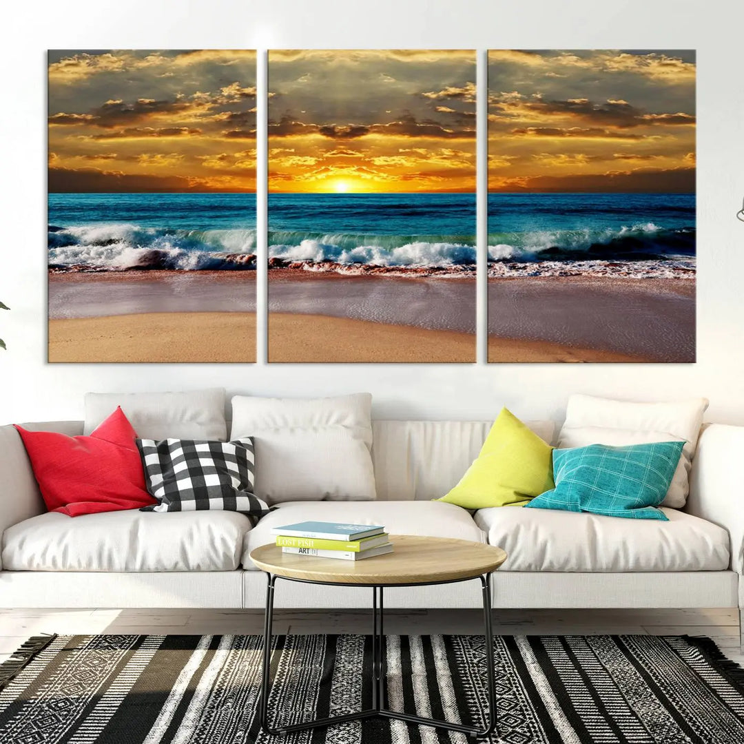 The Ocean Sunrise Over Golden Beach Waves giclee canvas wall art set hangs above, capturing a serene coastal sunset. This high-quality stretched canvas print brings warmth and tranquility to any living space.