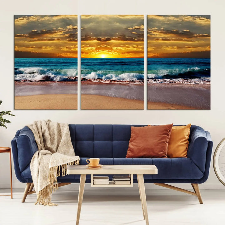 The Ocean Sunrise Over Golden Beach Waves giclee canvas wall art set hangs above, capturing a serene coastal sunset. This high-quality stretched canvas print brings warmth and tranquility to any living space.