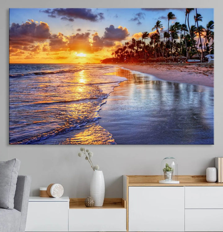 The dining area features a stunning Ocean Sunset Beach Canvas Print—a five-panel coastal wall art and tropical seascape triptych that beautifully captures the serene beauty of ocean waves set against a beach sunset scene.