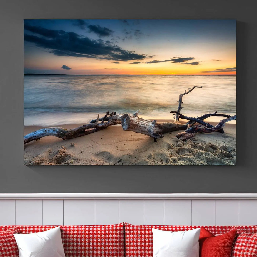 A captivating piece of Ocean Sunset Beach Wall Art Canvas Print, gallery wrapped, graces the gray wall.