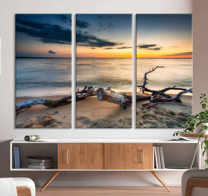 A captivating piece of Ocean Sunset Beach Wall Art Canvas Print, gallery wrapped, graces the gray wall.