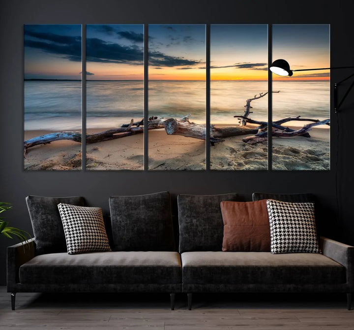 A captivating piece of Ocean Sunset Beach Wall Art Canvas Print, gallery wrapped, graces the gray wall.