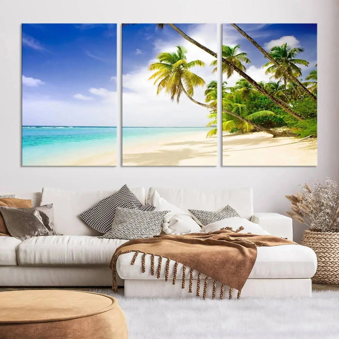 Above the beige sofa, the Ocean Tropical Beach Wall Art Print, featuring palm trees and crystal blue water, offers a calm ocean view, creating a tranquil oasis in the softly lit room.