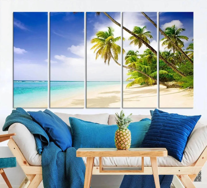 Above the beige sofa, the Ocean Tropical Beach Wall Art Print, featuring palm trees and crystal blue water, offers a calm ocean view, creating a tranquil oasis in the softly lit room.