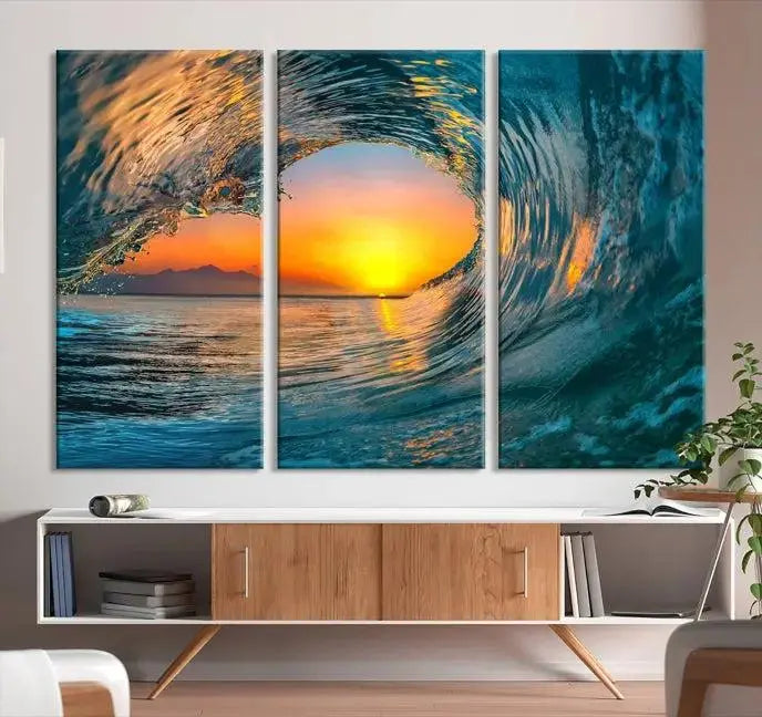 The Ocean Wave Sunset Wall Art, a large coastal wave canvas print comprising a 3-panel ocean sunset seascape, beautifully adorns the living room. This striking piece infuses the space with tranquility by capturing the serene beauty of an ocean wave against a sunset background.