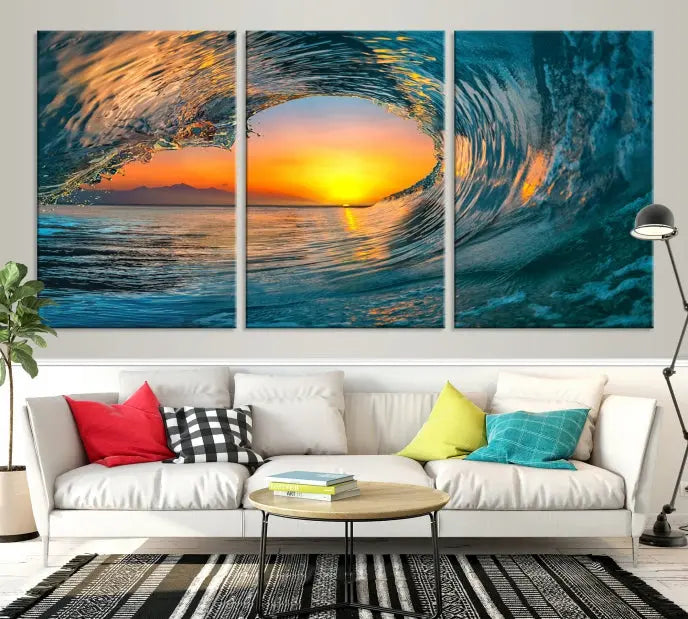 The Ocean Wave Sunset Wall Art, a large coastal wave canvas print comprising a 3-panel ocean sunset seascape, beautifully adorns the living room. This striking piece infuses the space with tranquility by capturing the serene beauty of an ocean wave against a sunset background.