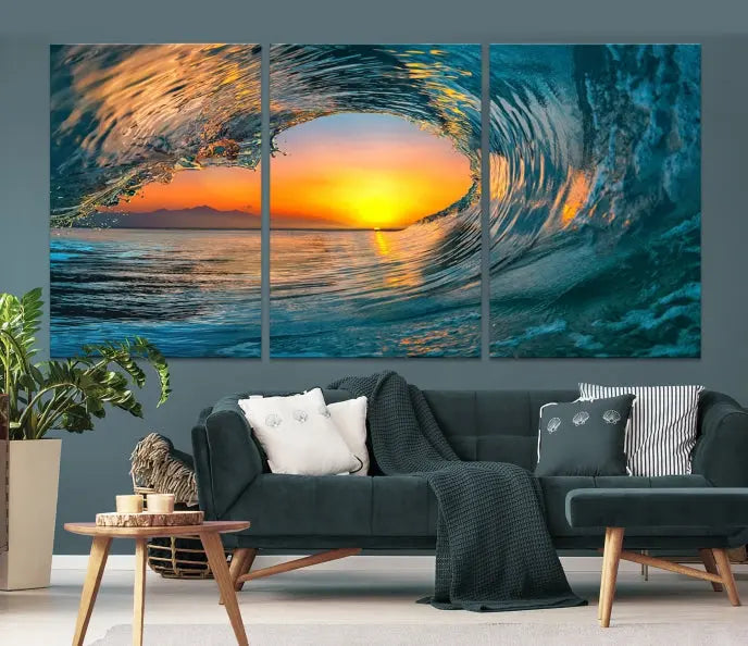 The Ocean Wave Sunset Wall Art, a large coastal wave canvas print comprising a 3-panel ocean sunset seascape, beautifully adorns the living room. This striking piece infuses the space with tranquility by capturing the serene beauty of an ocean wave against a sunset background.