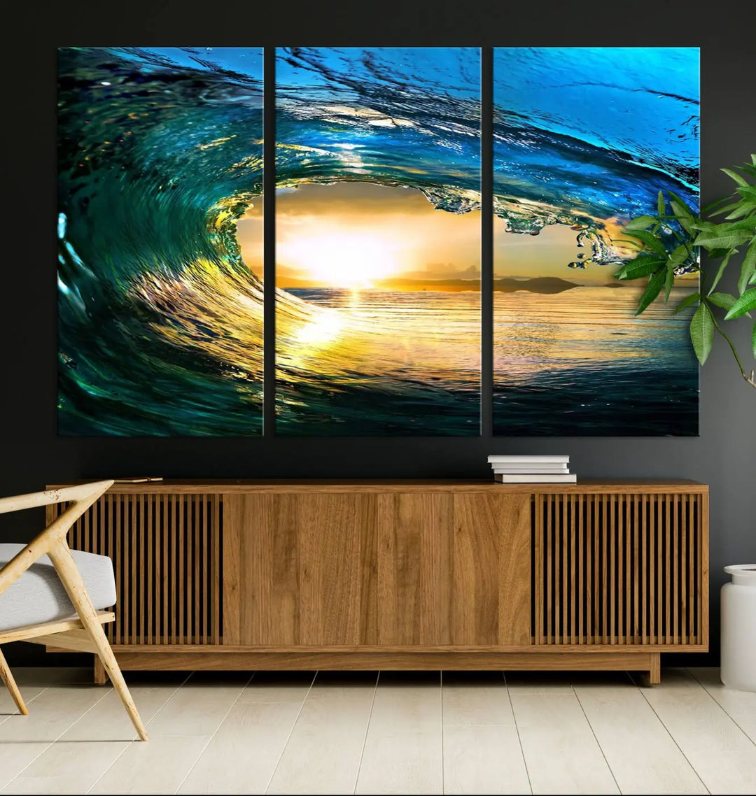 A modern dining room with a coastal vibe showcases a striking large wall print, the "Ocean Wave at Sunset Canvas Art," depicting vibrant water waves. The room features abstract wave artwork on the walls. This eye-catching piece of coastal art infuses the space with seaside serenity.