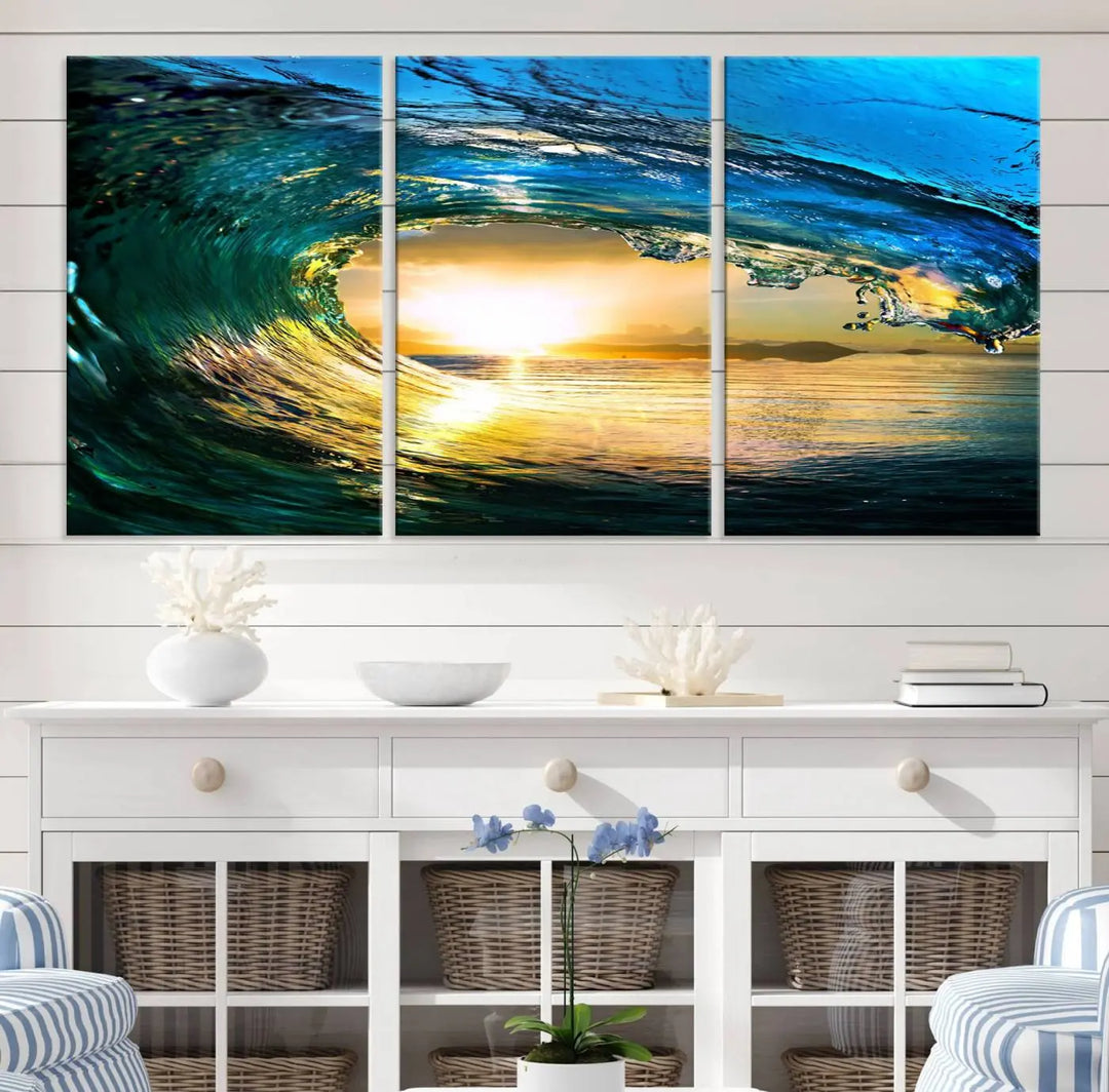 A modern dining room with a coastal vibe showcases a striking large wall print, the "Ocean Wave at Sunset Canvas Art," depicting vibrant water waves. The room features abstract wave artwork on the walls. This eye-catching piece of coastal art infuses the space with seaside serenity.