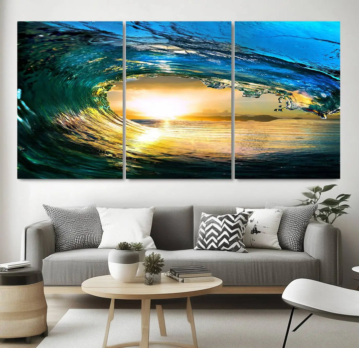 A modern dining room with a coastal vibe showcases a striking large wall print, the "Ocean Wave at Sunset Canvas Art," depicting vibrant water waves. The room features abstract wave artwork on the walls. This eye-catching piece of coastal art infuses the space with seaside serenity.