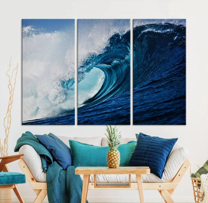 A large wall print of "Ocean Wave at Sunset Canvas Art" is displayed, creating a coastal vibe.