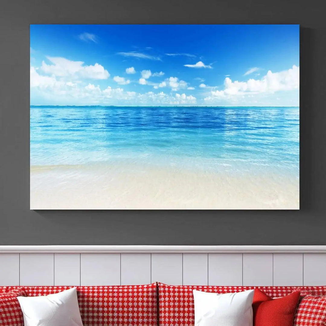 An Ocean and Beach Artwork Canvas Print Wall Art, divided into a triptych and crafted on museum-quality canvases ready to hang, decorates the wall.