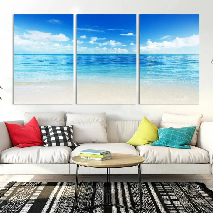 An Ocean and Beach Artwork Canvas Print Wall Art, divided into a triptych and crafted on museum-quality canvases ready to hang, decorates the wall.