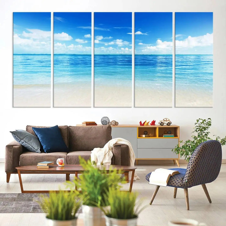 An Ocean and Beach Artwork Canvas Print Wall Art, divided into a triptych and crafted on museum-quality canvases ready to hang, decorates the wall.