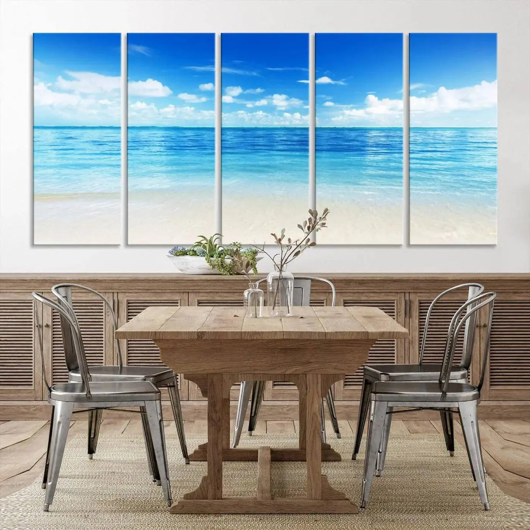 An Ocean and Beach Artwork Canvas Print Wall Art, divided into a triptych and crafted on museum-quality canvases ready to hang, decorates the wall.