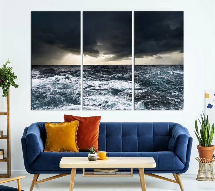 An Ocean and Storm Canvas Art Print, featuring a triptych of turbulent seas and skies on museum-quality canvas with UV-protective coating, is displayed above the living room. It enhances the space by bringing an effortlessly stylish touch.