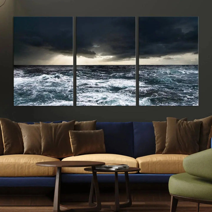 An Ocean and Storm Canvas Art Print, featuring a triptych of turbulent seas and skies on museum-quality canvas with UV-protective coating, is displayed above the living room. It enhances the space by bringing an effortlessly stylish touch.