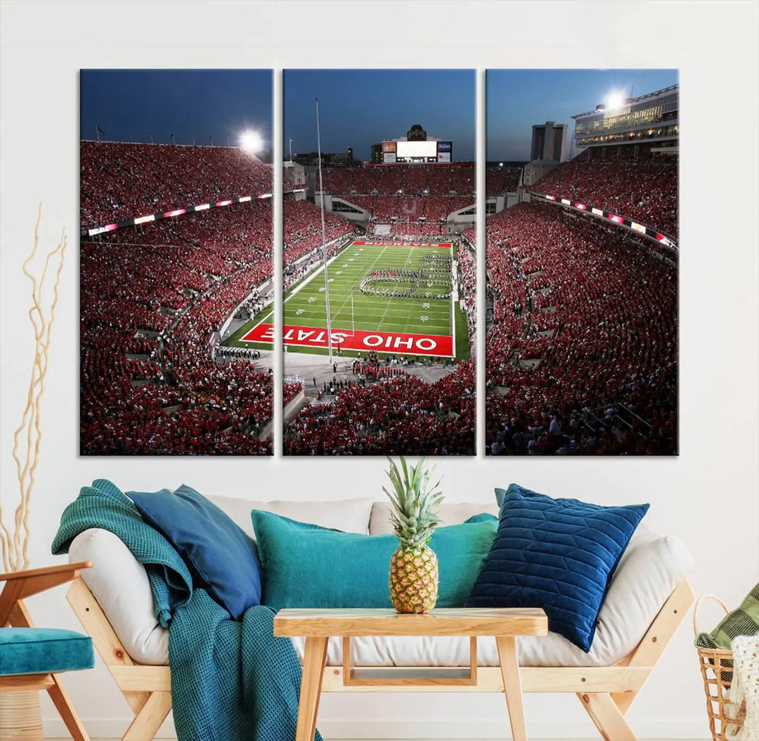 The Ohio State University Buckeyes Football Team Print, showcasing a vibrant view of the Columbus Ohio Stadium, is displayed in a modern room. Its gallery-quality finish enhances the space.