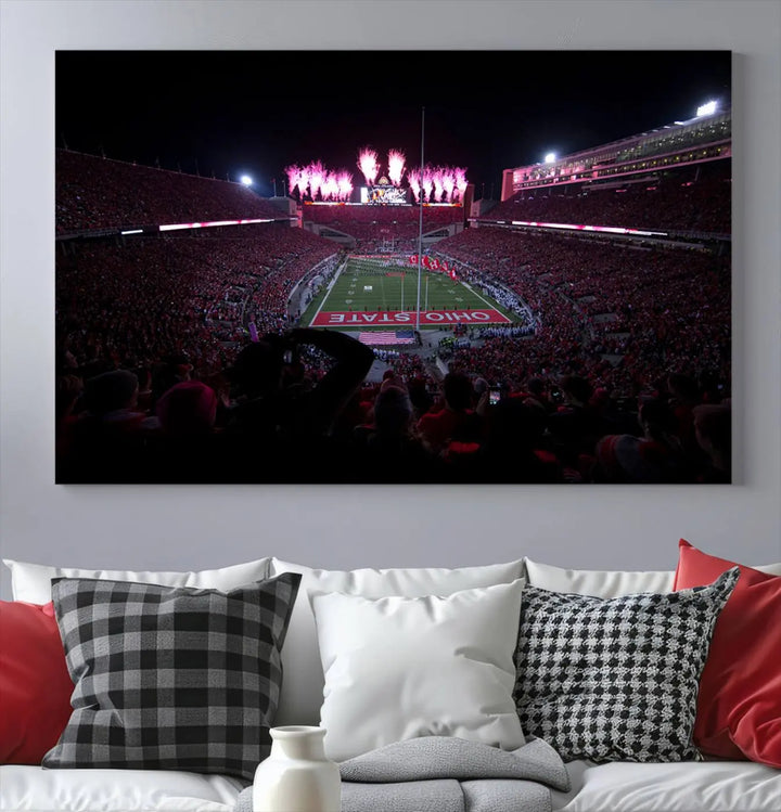 The living room features a breathtaking Ohio State University Buckeyes Football Team Print, depicting a stadium packed with fans, fireworks illuminating the sky, and Ohio State on the field. This Columbus Ohio Stadium Wall Art Canvas Print offers a vibrant display with a gallery-quality finish that instantly draws attention.