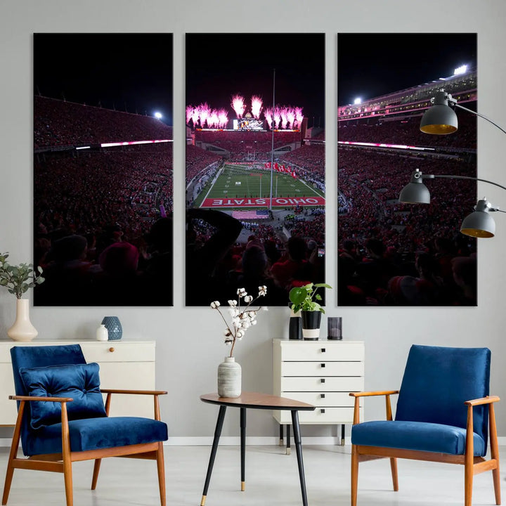 The living room features a breathtaking Ohio State University Buckeyes Football Team Print, depicting a stadium packed with fans, fireworks illuminating the sky, and Ohio State on the field. This Columbus Ohio Stadium Wall Art Canvas Print offers a vibrant display with a gallery-quality finish that instantly draws attention.