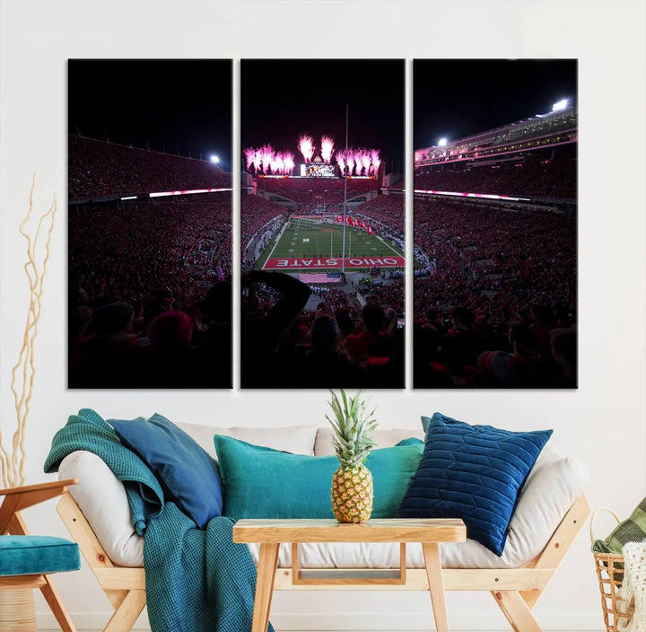 The living room features a breathtaking Ohio State University Buckeyes Football Team Print, depicting a stadium packed with fans, fireworks illuminating the sky, and Ohio State on the field. This Columbus Ohio Stadium Wall Art Canvas Print offers a vibrant display with a gallery-quality finish that instantly draws attention.