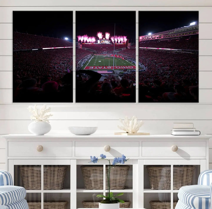 The living room features a breathtaking Ohio State University Buckeyes Football Team Print, depicting a stadium packed with fans, fireworks illuminating the sky, and Ohio State on the field. This Columbus Ohio Stadium Wall Art Canvas Print offers a vibrant display with a gallery-quality finish that instantly draws attention.