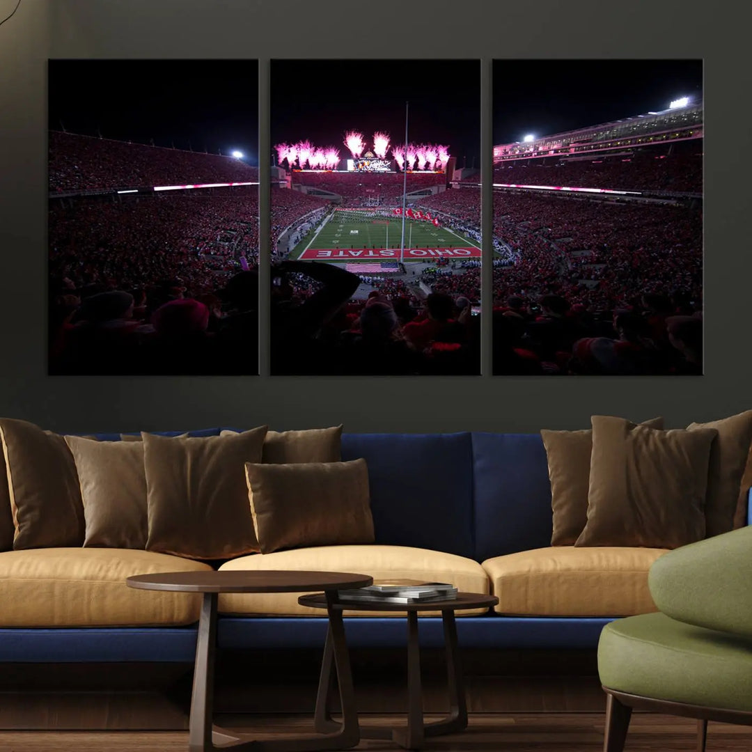 The living room features a breathtaking Ohio State University Buckeyes Football Team Print, depicting a stadium packed with fans, fireworks illuminating the sky, and Ohio State on the field. This Columbus Ohio Stadium Wall Art Canvas Print offers a vibrant display with a gallery-quality finish that instantly draws attention.