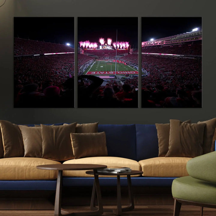 The living room features a breathtaking Ohio State University Buckeyes Football Team Print, depicting a stadium packed with fans, fireworks illuminating the sky, and Ohio State on the field. This Columbus Ohio Stadium Wall Art Canvas Print offers a vibrant display with a gallery-quality finish that instantly draws attention.