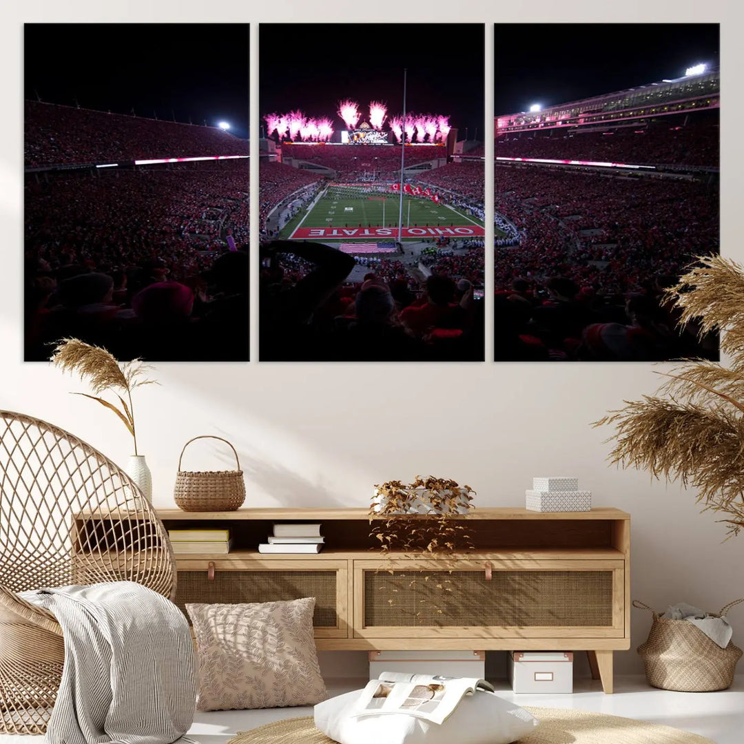 The living room features a breathtaking Ohio State University Buckeyes Football Team Print, depicting a stadium packed with fans, fireworks illuminating the sky, and Ohio State on the field. This Columbus Ohio Stadium Wall Art Canvas Print offers a vibrant display with a gallery-quality finish that instantly draws attention.