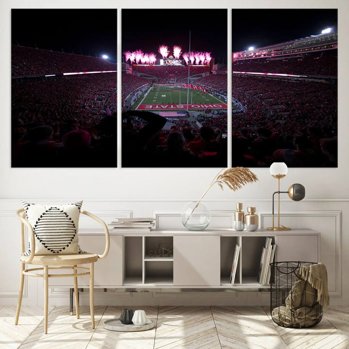 The living room features a breathtaking Ohio State University Buckeyes Football Team Print, depicting a stadium packed with fans, fireworks illuminating the sky, and Ohio State on the field. This Columbus Ohio Stadium Wall Art Canvas Print offers a vibrant display with a gallery-quality finish that instantly draws attention.