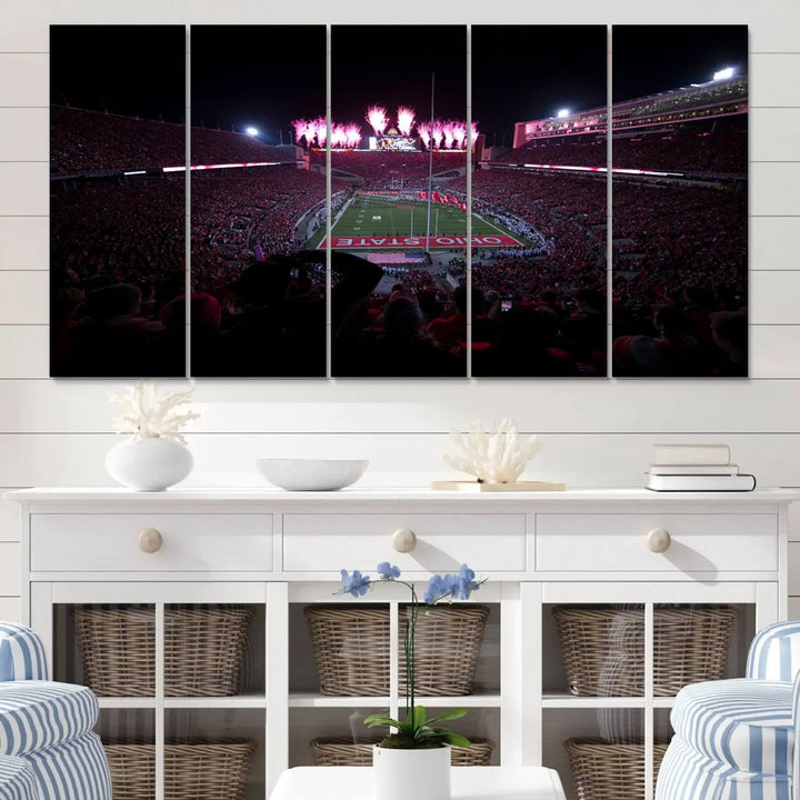 The living room features a breathtaking Ohio State University Buckeyes Football Team Print, depicting a stadium packed with fans, fireworks illuminating the sky, and Ohio State on the field. This Columbus Ohio Stadium Wall Art Canvas Print offers a vibrant display with a gallery-quality finish that instantly draws attention.