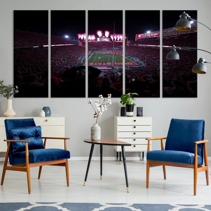 The living room features a breathtaking Ohio State University Buckeyes Football Team Print, depicting a stadium packed with fans, fireworks illuminating the sky, and Ohio State on the field. This Columbus Ohio Stadium Wall Art Canvas Print offers a vibrant display with a gallery-quality finish that instantly draws attention.