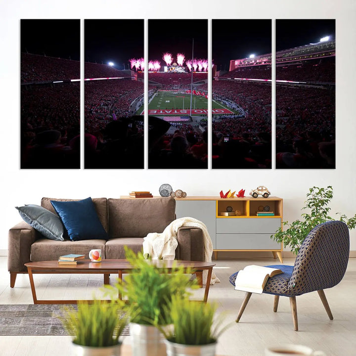 The living room features a breathtaking Ohio State University Buckeyes Football Team Print, depicting a stadium packed with fans, fireworks illuminating the sky, and Ohio State on the field. This Columbus Ohio Stadium Wall Art Canvas Print offers a vibrant display with a gallery-quality finish that instantly draws attention.