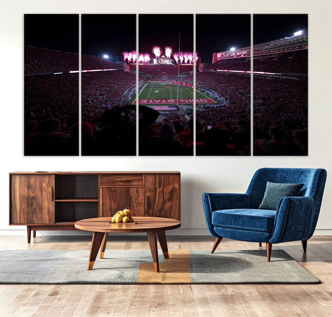 The living room features a breathtaking Ohio State University Buckeyes Football Team Print, depicting a stadium packed with fans, fireworks illuminating the sky, and Ohio State on the field. This Columbus Ohio Stadium Wall Art Canvas Print offers a vibrant display with a gallery-quality finish that instantly draws attention.