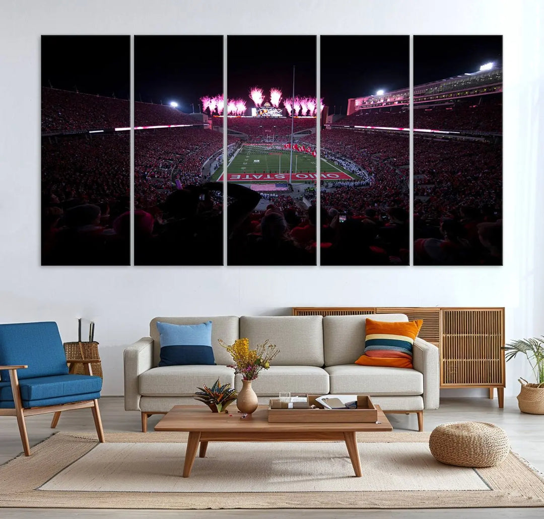 The living room features a breathtaking Ohio State University Buckeyes Football Team Print, depicting a stadium packed with fans, fireworks illuminating the sky, and Ohio State on the field. This Columbus Ohio Stadium Wall Art Canvas Print offers a vibrant display with a gallery-quality finish that instantly draws attention.