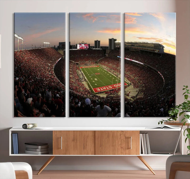 An Ohio State University Buckeyes Football Team print featuring the Columbus Ohio Stadium, beautifully crafted on premium canvas for a gallery-quality finish, adorns the wall.