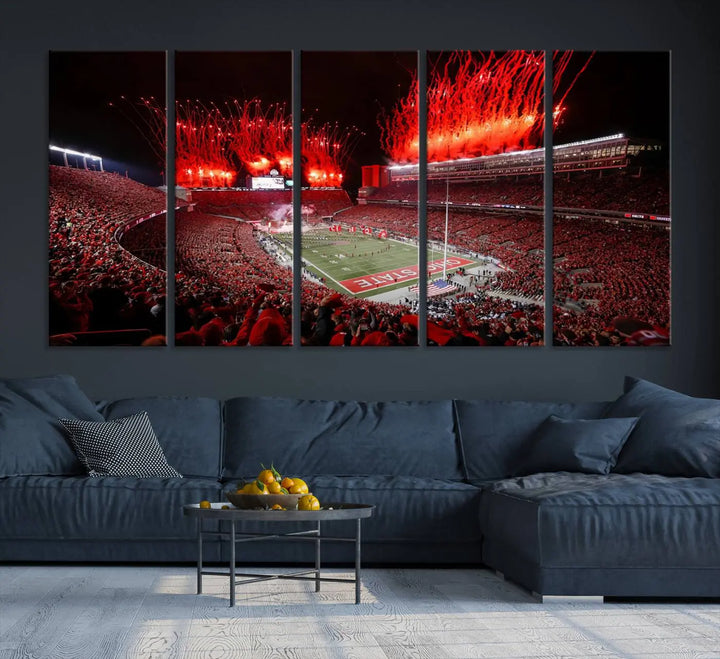 The Ohio State University Buckeyes Football Team Print showcases a vibrant Columbus Ohio Stadium, teeming with fans and illuminated by red fireworks against the night sky. Printed on premium canvas with a gallery-quality finish, this exquisite piece of wall art makes an elegant statement and enhances any space with sophistication.