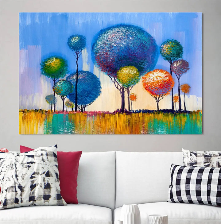 The vibrant "Oil Paint Effect Colorful Trees Wall Art Canvas Print," with its abstract depiction of round-topped trees on a blue background, is printed on museum-quality canvas and includes a UV-protective coating to maintain its bright colors.