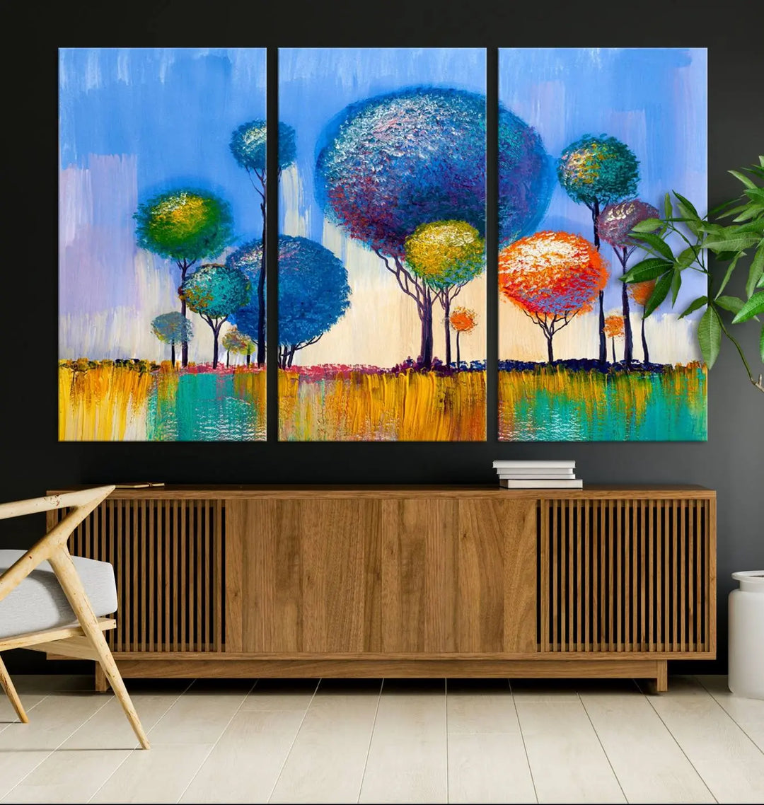 The vibrant "Oil Paint Effect Colorful Trees Wall Art Canvas Print," with its abstract depiction of round-topped trees on a blue background, is printed on museum-quality canvas and includes a UV-protective coating to maintain its bright colors.