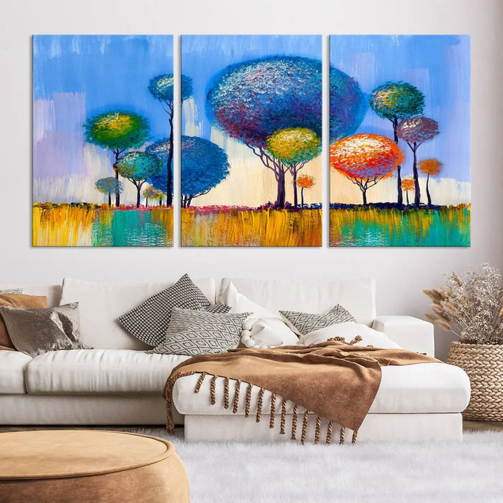 The vibrant "Oil Paint Effect Colorful Trees Wall Art Canvas Print," with its abstract depiction of round-topped trees on a blue background, is printed on museum-quality canvas and includes a UV-protective coating to maintain its bright colors.