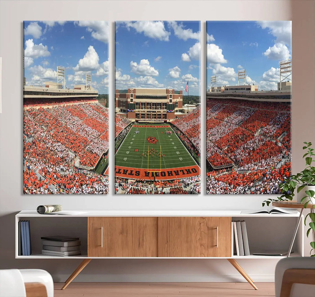 This three-panel canvas artwork, titled "Oklahoma State Cowboys Football Team Print - Stillwater Boone Pickens Stadium Wall Art Canvas Print," captures a full football stadium with vibrant orange and white crowd sections beneath a clear sky. Each piece features a gallery-quality finish, ideal for adding dynamic energy to any space.