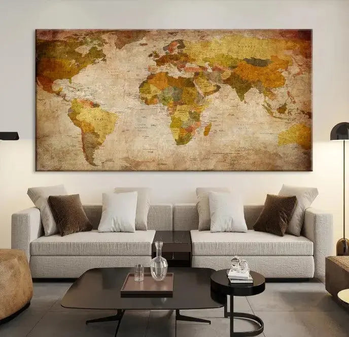 The Old Antique World Map Wall Art Canvas Print, featuring a three-panel vintage design and crafted with museum-quality canvas and UV-protective coating, hangs elegantly against a dark wall.