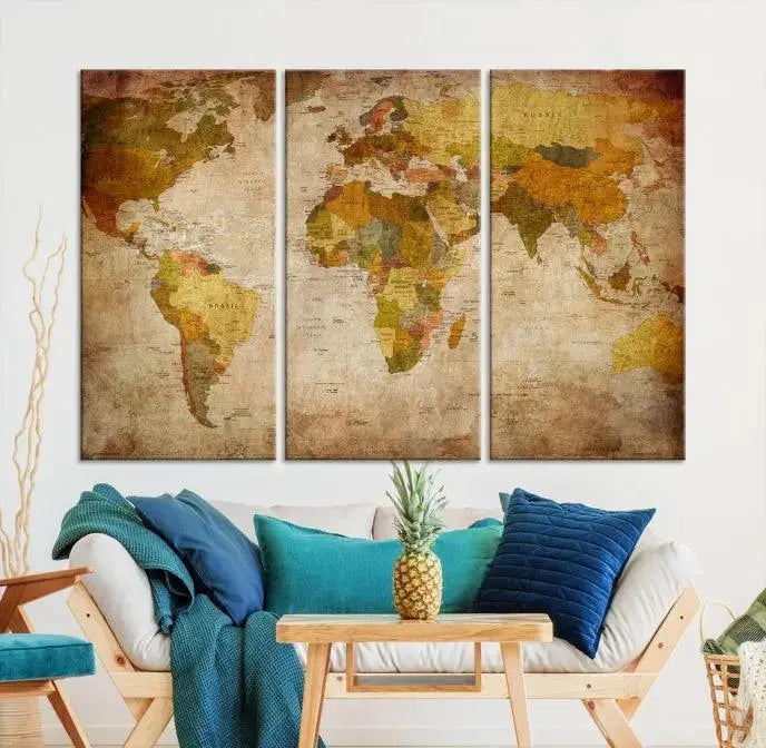 The Old Antique World Map Wall Art Canvas Print, featuring a three-panel vintage design and crafted with museum-quality canvas and UV-protective coating, hangs elegantly against a dark wall.