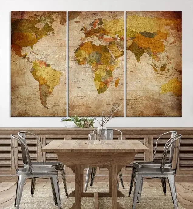 The Old Antique World Map Wall Art Canvas Print, featuring a three-panel vintage design and crafted with museum-quality canvas and UV-protective coating, hangs elegantly against a dark wall.