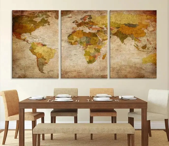 The Old Antique World Map Wall Art Canvas Print, featuring a three-panel vintage design and crafted with museum-quality canvas and UV-protective coating, hangs elegantly against a dark wall.